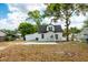 Large backyard space with mature trees and a well-manicured lawn, offering privacy and serenity at 712 Maryland Ave, St Cloud, FL 34769