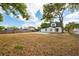 Expansive backyard featuring a well-maintained lawn, perfect for outdoor activities and gatherings at 712 Maryland Ave, St Cloud, FL 34769