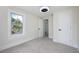 Bright and airy bedroom with neutral tones, plush carpet, and natural lighting at 712 Maryland Ave, St Cloud, FL 34769