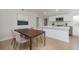 Bright dining area adjacent to the kitchen featuring modern decor and wood floors at 712 Maryland Ave, St Cloud, FL 34769