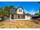 Charming two-story home with a cozy front porch and a well-manicured lawn, perfect for enjoying the outdoors at 712 Maryland Ave, St Cloud, FL 34769