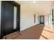 Welcoming front porch featuring a stylish entrance door and ample space for outdoor decor, creating a warm ambiance at 712 Maryland Ave, St Cloud, FL 34769