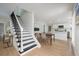 Open-concept living space with staircase, seamlessly connecting to the dining and kitchen areas, great for entertaining at 712 Maryland Ave, St Cloud, FL 34769