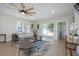Elegant living room featuring large windows and modern decor, providing a perfect space for relaxation and entertainment at 712 Maryland Ave, St Cloud, FL 34769