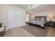 Light and airy main bedroom featuring wood floors and modern lighting fixture at 712 Maryland Ave, St Cloud, FL 34769