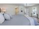 Stylish main bedroom features a modern gray color scheme and ensuite bathroom at 712 Maryland Ave, St Cloud, FL 34769