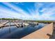 Marina with many boats docked under a blue sky with puffy white clouds on a sunny day at 712 Maryland Ave, St Cloud, FL 34769