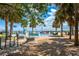 Splash pad with playground equipment and benches and families playing under a blue sky at 712 Maryland Ave, St Cloud, FL 34769