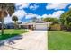 Charming single-story home with a well-manicured lawn and attached two car garage at 713 Coach Light Dr, Fern Park, FL 32730