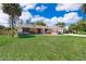 Beautiful single-story home with a spacious lawn and attached two car garage at 713 Coach Light Dr, Fern Park, FL 32730