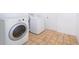 Laundry room with matching washer and dryer units and ceramic tile floors at 713 Coach Light Dr, Fern Park, FL 32730