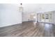 Spacious living room with gray wood-look flooring and French doors leading to the exterior at 713 Coach Light Dr, Fern Park, FL 32730