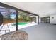 Screened-in patio with a pristine pool, spacious deck, and lush landscaping at 713 Coach Light Dr, Fern Park, FL 32730