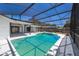 Screened in pool with a large patio area, perfect for entertaining at 713 Coach Light Dr, Fern Park, FL 32730