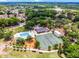 Wonderful aerial view of community amenities showcasing a swimming pool, tennis court, and recreational facilities at 717 Pine Ter, Altamonte Springs, FL 32714