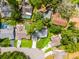 An aerial perspective shows a well-maintained property with green spaces nestled among mature trees and quiet streets at 717 Pine Ter, Altamonte Springs, FL 32714