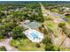Community amenities including a pool and tennis courts are highlighted in this aerial view of the property at 717 Pine Ter, Altamonte Springs, FL 32714