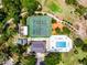 Stunning aerial shot of community pool and tennis courts, complete with lush landscaping and community features at 717 Pine Ter, Altamonte Springs, FL 32714