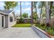Backyard features a lawn, garden beds, and mature trees at 717 Pine Ter, Altamonte Springs, FL 32714