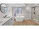 Bright bathroom features a double vanity, free standing tub, and a separate tiled shower at 717 Pine Ter, Altamonte Springs, FL 32714