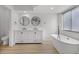 Spacious primary bathroom featuring a double vanity, free standing tub, and tile floors at 717 Pine Ter, Altamonte Springs, FL 32714