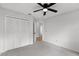 Clean bedroom features ceiling fan, neutral decor, and closet at 717 Pine Ter, Altamonte Springs, FL 32714