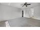 This bedroom features carpet, a ceiling fan, and is accessible to the ensuite bathroom at 717 Pine Ter, Altamonte Springs, FL 32714