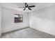 Clean bedroom features ceiling fan, neutral decor, and sunny window at 717 Pine Ter, Altamonte Springs, FL 32714