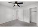 Bedroom featuring neutral carpet, a ceiling fan, and closet with white louvered doors at 717 Pine Ter, Altamonte Springs, FL 32714