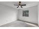 Cozy bedroom with large window, ceiling fan, and neutral decor at 717 Pine Ter, Altamonte Springs, FL 32714