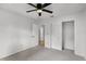 Neutral bedroom with closet, ceiling fan, and door to another room at 717 Pine Ter, Altamonte Springs, FL 32714