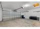 Spacious garage with overhead door, ceiling light, and concrete floor at 717 Pine Ter, Altamonte Springs, FL 32714