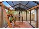 Interior of a greenhouse with wooden beams, shelving, and plants at 717 Pine Ter, Altamonte Springs, FL 32714
