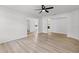 Spacious living room with light wood-look flooring, neutral paint, and open layout at 717 Pine Ter, Altamonte Springs, FL 32714