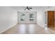 Bright living room featuring ample natural light, a ceiling fan, and light-colored wood-look floors at 717 Pine Ter, Altamonte Springs, FL 32714