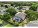 Aerial view showcasing the backyard pool and patio of a home in a lush, green neighborhood at 7978 Sea Pearl Cir, Kissimmee, FL 34747