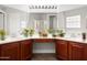 Bathroom features double sinks, a vanity, and multiple mirrors. A great design! at 7978 Sea Pearl Cir, Kissimmee, FL 34747
