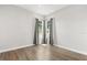 Bright, empty bedroom features hardwood floors and neutral walls, offering a blank canvas for personalization at 7978 Sea Pearl Cir, Kissimmee, FL 34747
