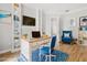 Bright home office with custom built-in shelves, modern decor, and a comfortable workspace for productivity at 7978 Sea Pearl Cir, Kissimmee, FL 34747
