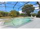 Enclosed pool with attached jacuzzi featuring a spa-like atmosphere with landscaping and comfortable seating around the area at 7978 Sea Pearl Cir, Kissimmee, FL 34747