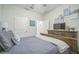 Comfortable bedroom with a plush bed, wooden dresser, and stylish decorative wall art pieces at 8907 Fallen Oak, Davenport, FL 33897
