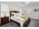 Cozy bedroom featuring a plush bed, warm lighting, and a view into the en-suite bathroom at 8907 Fallen Oak, Davenport, FL 33897