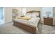 Spacious bedroom featuring carpet flooring, a wooden bed frame, and lots of natural light at 8907 Fallen Oak, Davenport, FL 33897