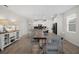 Bright kitchen with white cabinetry, stainless steel appliances, and an eat-in kitchen island with barstool seating at 8907 Fallen Oak, Davenport, FL 33897