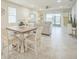 Open floor plan featuring a dining area that flows into the living space with ample natural light at 8907 Fallen Oak, Davenport, FL 33897