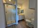 A clean bathroom with a shower, vanity, and toilet at 911 N Orange Ave # 545, Orlando, FL 32801