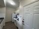 Well-lit kitchen boasts white appliances, ample counter space, and modern flooring, offering a clean and functional design at 911 N Orange Ave # 545, Orlando, FL 32801