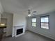 Comfortable living area with a fireplace, ceiling fan, and abundant natural light from the windows at 911 N Orange Ave # 545, Orlando, FL 32801