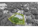 Highlighted aerial view showing property lines and landscaping surrounded by greenery in black and white at 940 Lincoln Cir, Winter Park, FL 32789
