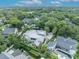 Detailed aerial shot of a luxury home featuring a pool, lush landscaping, and spacious grounds at 940 Lincoln Cir, Winter Park, FL 32789